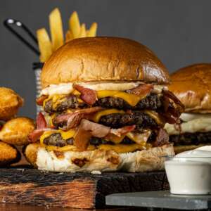 Triple Beef Burger on Wooden Board